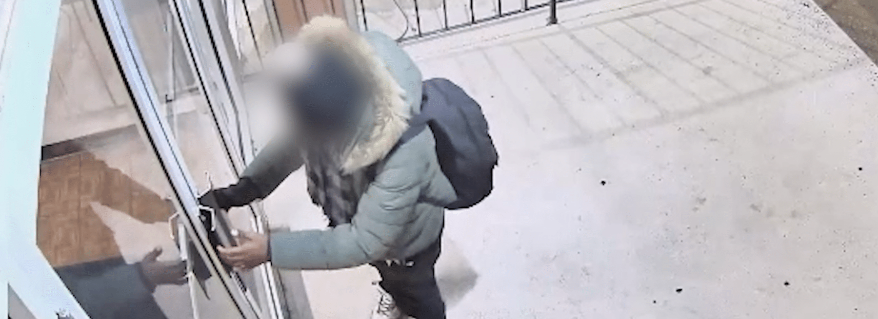 Person Loitering Outside Apartment Building Hero