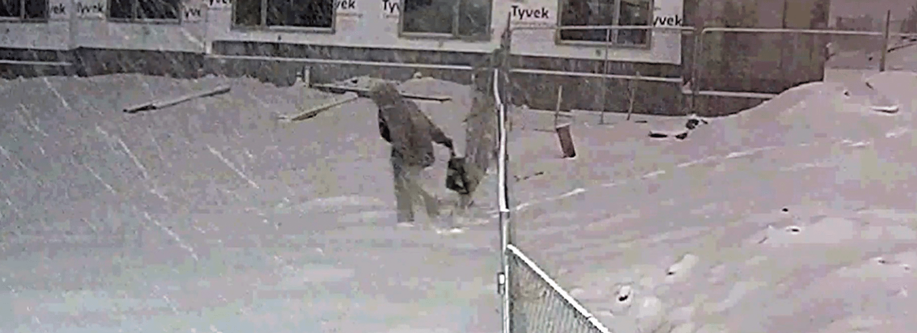 Trespasser on snowy construction site