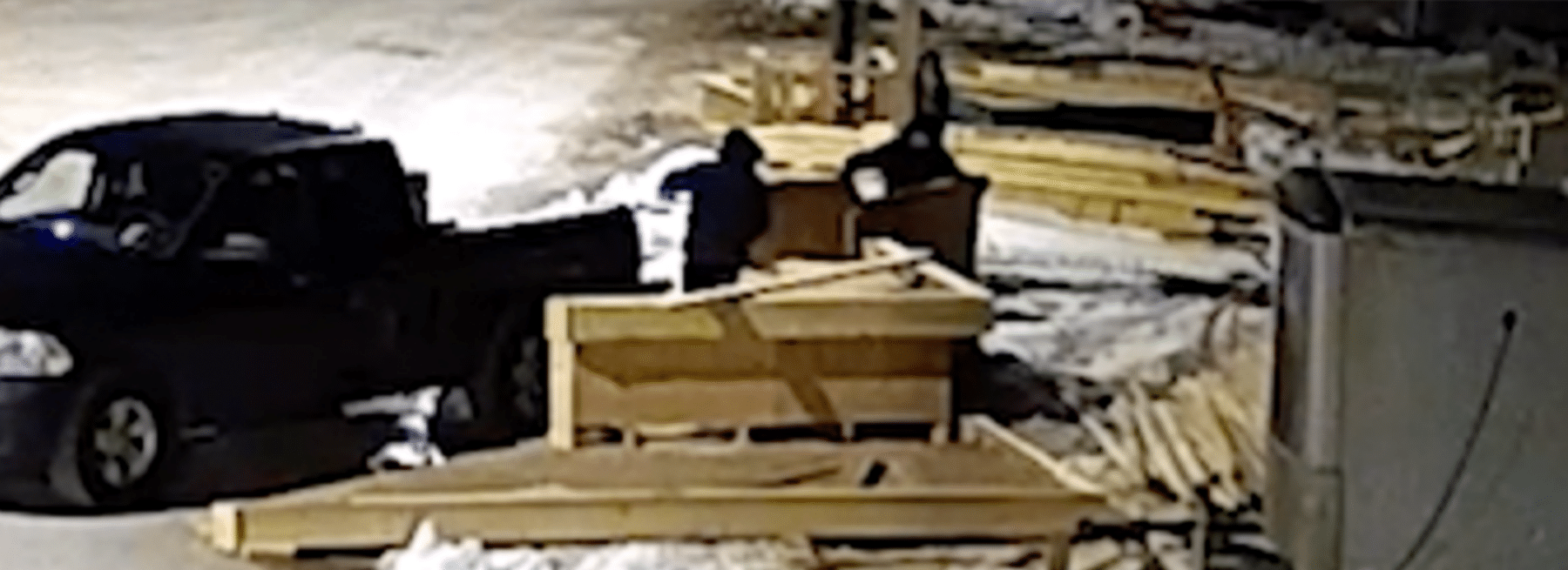 Thieves stealing plywood from construction site