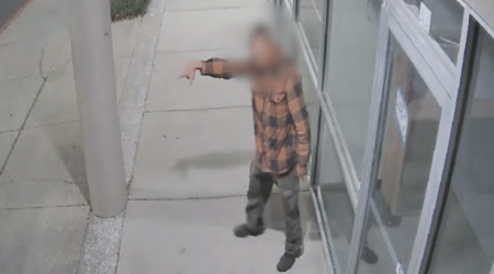 Homeless Individual Behaving Erratically in Front of Shopping Center Hero