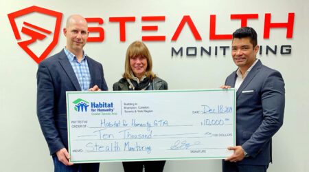 Stealth Monitoring Presents Check to Habitat for Humanity hero scaled 1