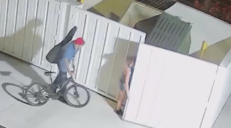 Three People Loitering by Dumpsters Behind Shopping Center Hero