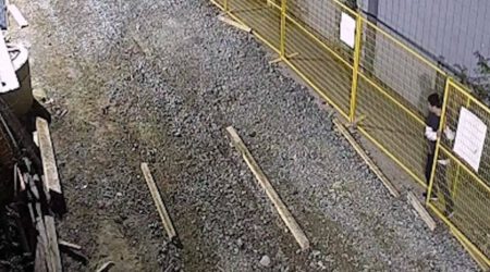 Trespasser Squeezes Through Construction Site Perimeter Fence Hero scaled 1