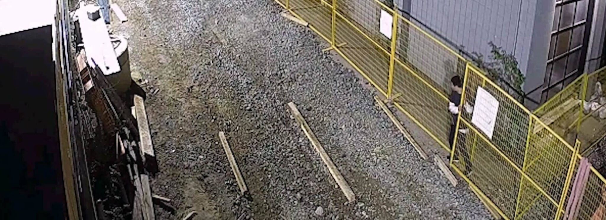 Trespasser Squeezes Through Construction Site Perimeter Fence Hero scaled 1