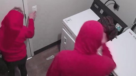 Two People Caught Tampering with Camera in Apartment Laundry Room Hero